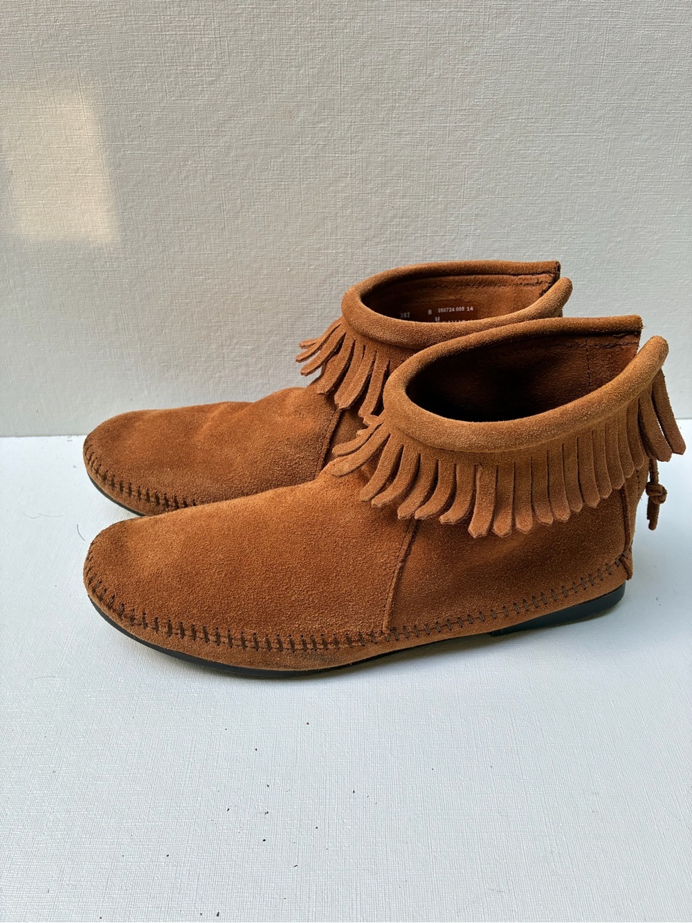 Minnetonka Suede Fringe Ankle Booties in Chestnut Brown